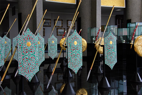 Shields and daggers on display in the Royal Regalia Museum