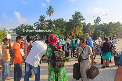 The guesthouse and hotel staff on Maafushi greeting tourists at the ferry upon arrival