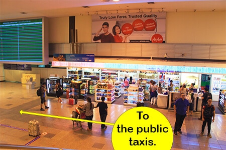 Once you head down the escalators at Don Mueang start looking for the taxi signs