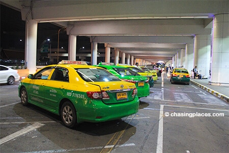 The taxis parked right outside the taxi desk at Don Mueang International Airport