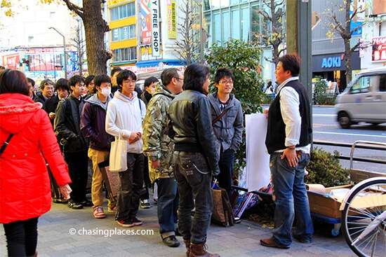 Otaku in Akihabara, awaiting an Anime poster release.