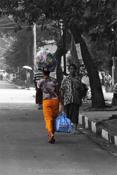 Ever wonder how sandals make their way to markets in Yangon? This middle aged woman was walking much quicker than me as she balanced this asymmetric load. 