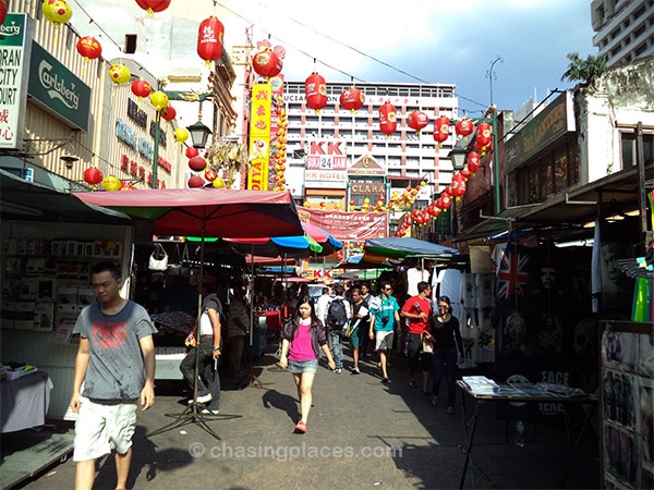 Shoppers navigating through the pedestrian traffic in Petaling Street (China Town) 