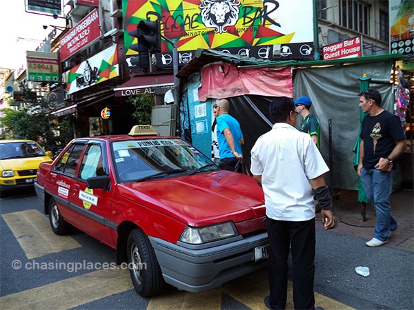 Taxi drivers tend to stay as close as possible to the entrance of Petaling Steet to secure rides with tourists