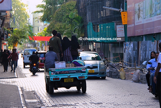 Five people using the real back seat in Male