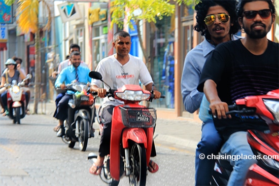 Some local Maldivians whisking by on the streets of Male