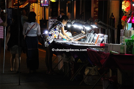 A local vendor preparing some jewellery for the Jonker Walk Night Market, Melaka