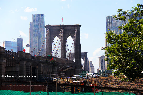 Very close to the steps leading up to the Brooklyn Bridge